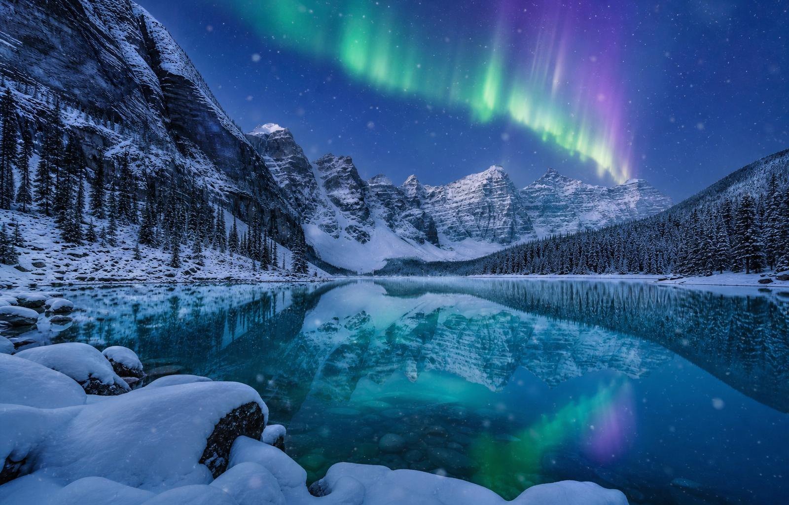 Canadian Rocky Mountains in Banff at blue hour, reflected in an alpine lake